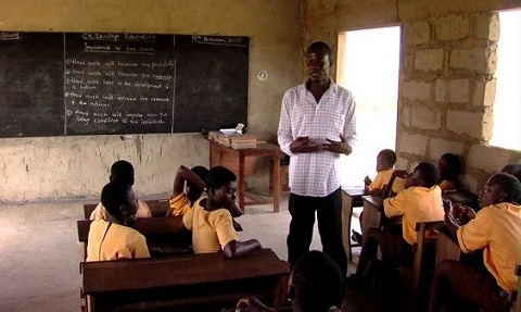 File Photo of a teacher and some pupils