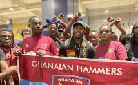 Image of Michail Antonio (in black cap) and West Ham supporters group in Ghana