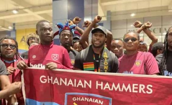 Image of Michail Antonio (in black cap) and West Ham supporters group in Ghana