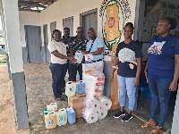 The Bryan Kwabena Osei Baah Memorial Foundation presenting the essential items to the facility