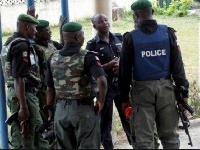 Police Officers arrived at the site of a car bomb explosion in Kano, Nigeria,
