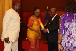 President Akufo-Addo presenting the leadership of the FHU with their presidential charter