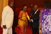 President Akufo-Addo presenting the leadership of the FHU with their presidential charter