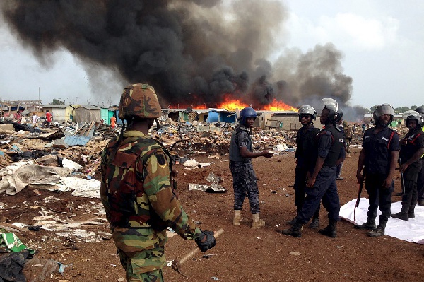 Police officers overseeing the removal of Sodom and Gomorrah. Photo: Reuters.