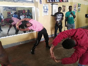 Joseph Agbeko going through aerobics with his fitness trainer Frank Dzidefo Toulassi