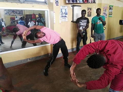 Joseph Agbeko going through aerobics with his fitness trainer Frank Dzidefo Toulassi