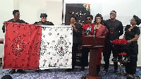 A black-and-red cloth bearing the image of the late Apostle has been designated for the burial