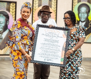 Samira Bawumia being presented with a citation of honour by the dressmakers