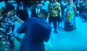 Bishop Obinim putting a ring on one of the single ladies he prayed for
