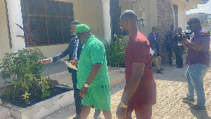 Veteran actor Koo Ofori (middle in shorts) at the Dansoman District Court on Monday
