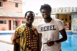 Thomas Partey (R) with his father