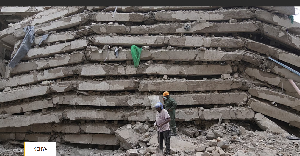 Security personnel work at the scene after a multi-storey building collapsed in Nairobi