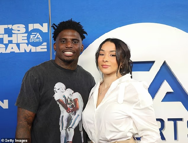Dolphin star Tyreek Hill (L) with his estranged wife Keeta Vacarro (R)