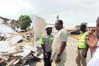 Obuasi MCE and contractors at demolishing site