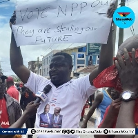 The man in the NPP branded T-shirt who joined the  #OccupyBoG protest