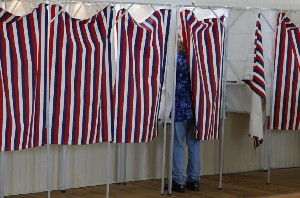 Voters cast ballots in New Hampshire’s primary ahead of the November midterms
