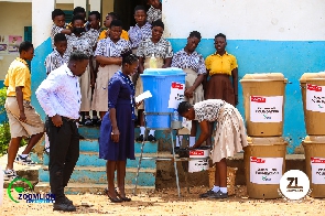 Some students washing their hands