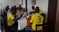 Asante Kotoko players having breakfast.