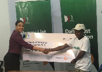 Daniel List's mother presents cheque to Afi Amezado (right)