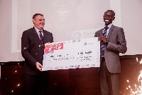 Joshua Ayinbora of JE&F Company receiving his prize