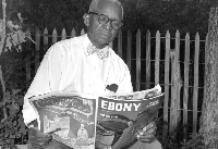 John Johnson perusing the July 1950 issue of Ebony magazine. Credit: Neal Douglass/Austin History