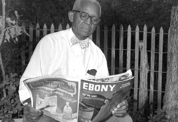 John Johnson perusing the July 1950 issue of Ebony magazine. Credit: Neal Douglass/Austin History