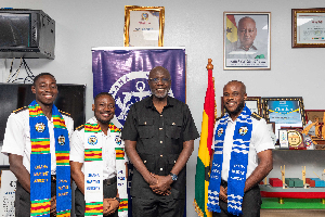 The DG of the GMA with the three cadets who are embarking on the seatime training