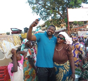 John Dumelo with Tamale market women