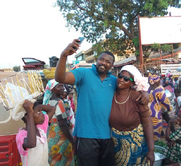 John Dumelo with Tamale market women