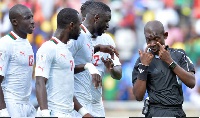 Senegal players confront Joseph Lamptey