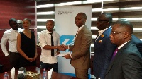 Andre Ayew at the signing ceremony with Dr. Kwabena Duffuor Jnr among others