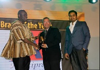 Business Development Minister Ibrahim Awal, presenting the award to representatives from Indomie