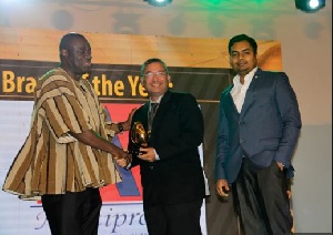 Business Development Minister Ibrahim Awal, presenting the award to representatives from Indomie