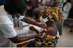 A resident being administered a covid-19 vaccination jab