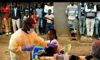 A doctor administering Ebola vaccine to a patiet in the DR Congo