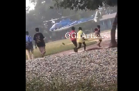 Local residents running towards the helicopter that wa preparing to land