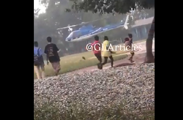 Local residents running towards the helicopter that wa preparing to land