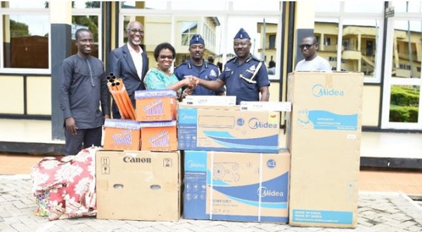 Theodosia Jackson, principal of the school handing over the items to the police administration