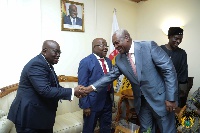 Former President, John Dramani Mahama (R) exchanging a handshake with President Nana Akufo-Addo (L)