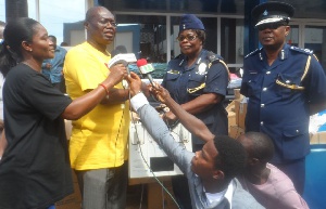 ACP Agnes Maclean (2nd right) receiving the items from Samuel Sackey on behalf of the Hospital