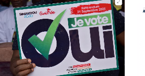 A citizen holds a sign as they take part in a rally during the awareness campaign