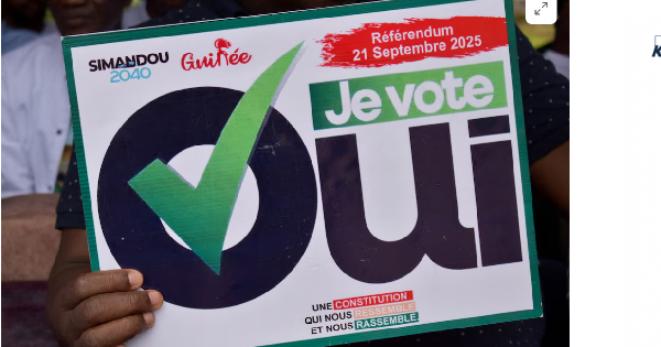 A citizen holds a sign as they take part in a rally during the awareness campaign