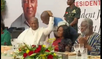 John Mahama holding Appiah Stadium's head to give him a knock