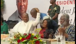 John Mahama holding Appiah Stadium's head to give him a knock