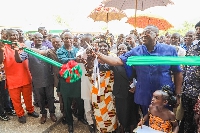 Dr. Ben K. D. Asante cutting the ribbon for the commissioning of the project
