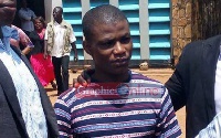 Daniel Asiedu being escorted to prison after a court hearing