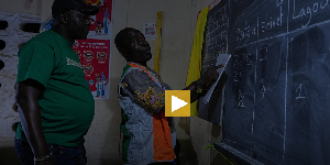 Officials count votes at a polling station in Yopougon as polls close during the elections