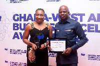 Head of Retail Banking,  Peter Dery and Team Lead,Treasury Sales, Phyllis Adu with the award