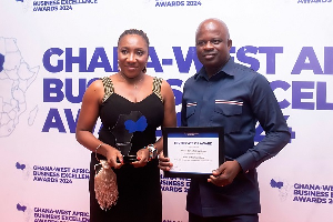 Head of Retail Banking,  Peter Dery and Team Lead,Treasury Sales, Phyllis Adu with the award