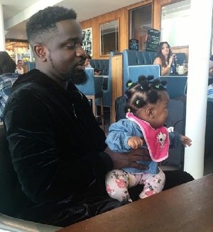 Sarkodie holding his fast growing daughter